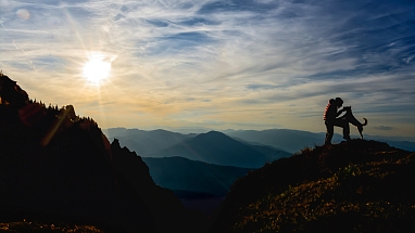 Man with dog on a mountain